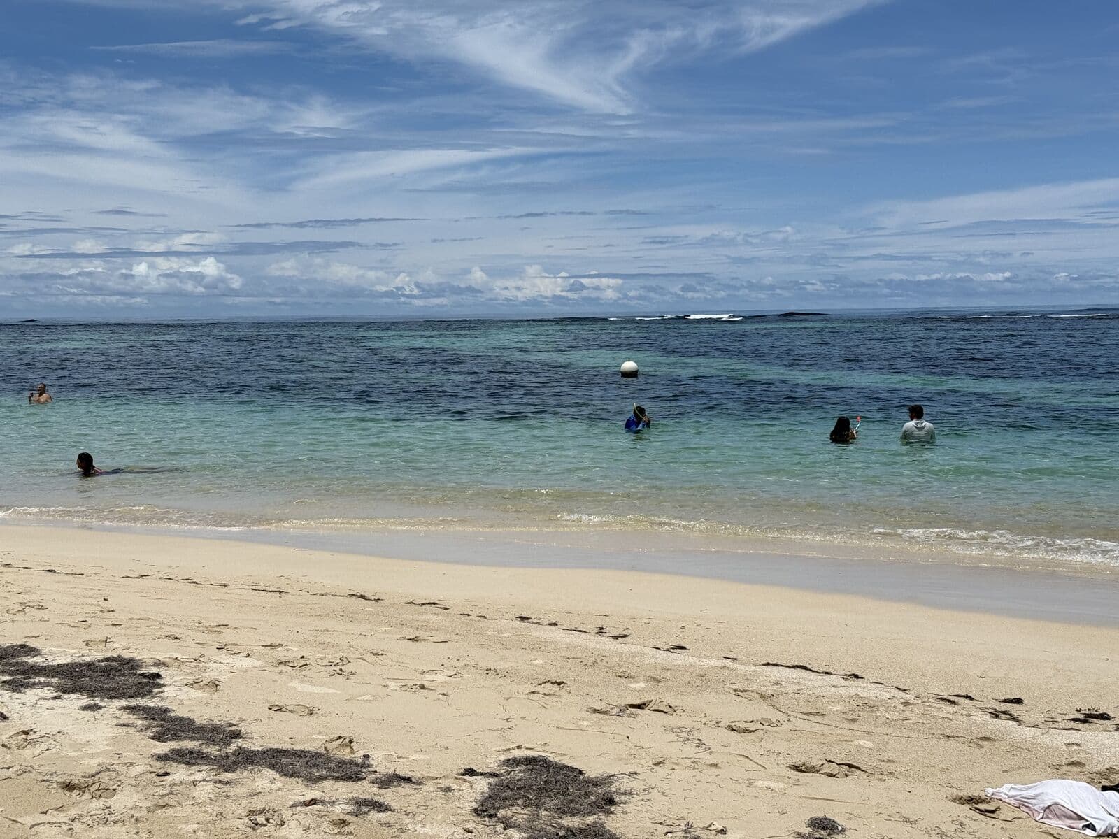 Turquoise bay with swimmers in Bocas del Toro, Panama