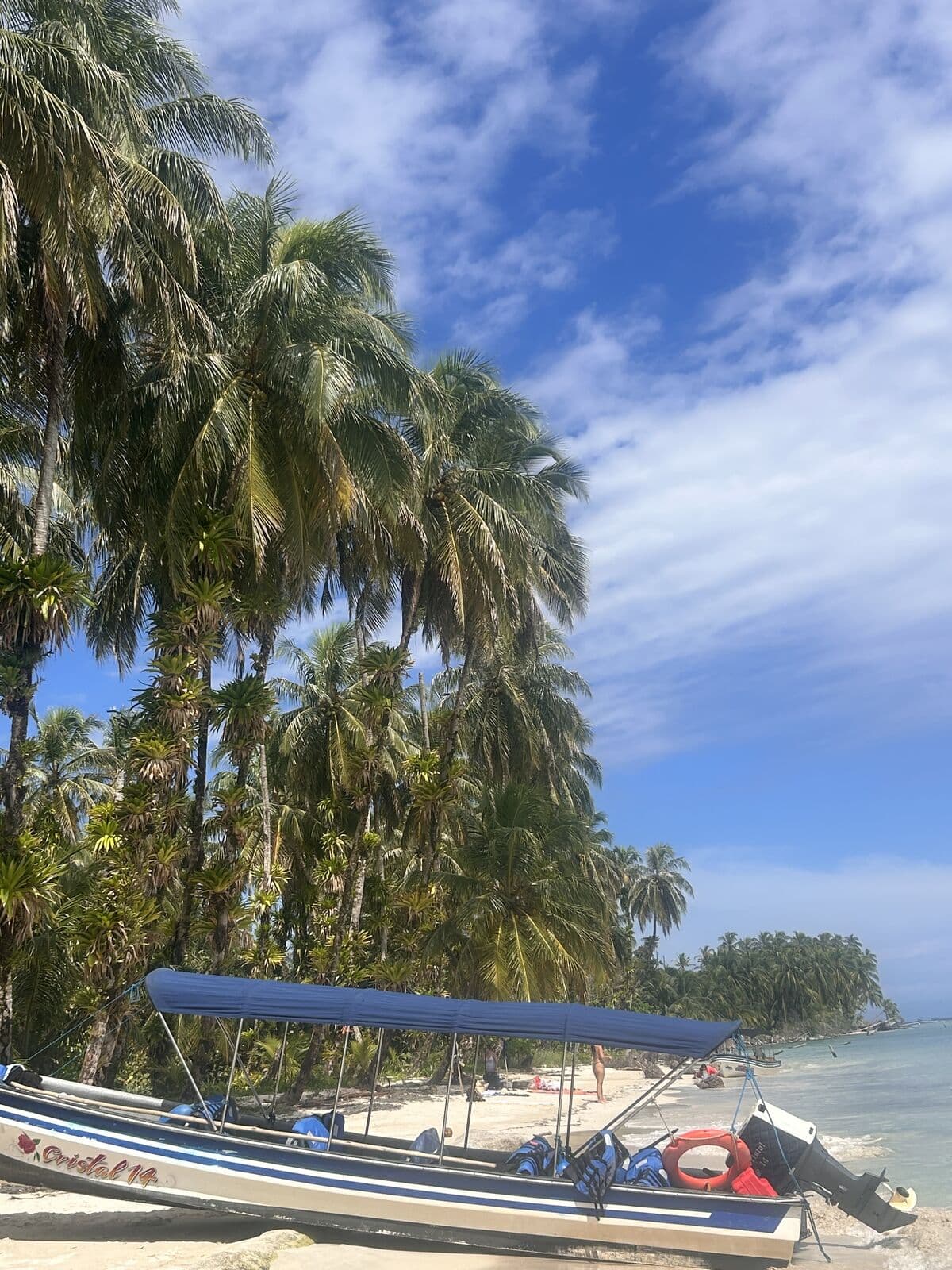 Boat arriving at the white-sand shore of the Zapatilla Cays